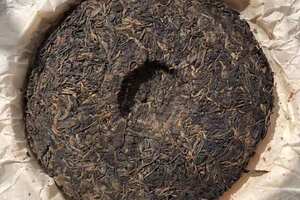 

99年第一批红丝带老树圆茶，老生干仓茶，茶面